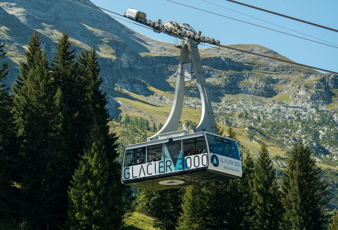 The Glacier 3000 cable car travels up from forests to snowy peaks